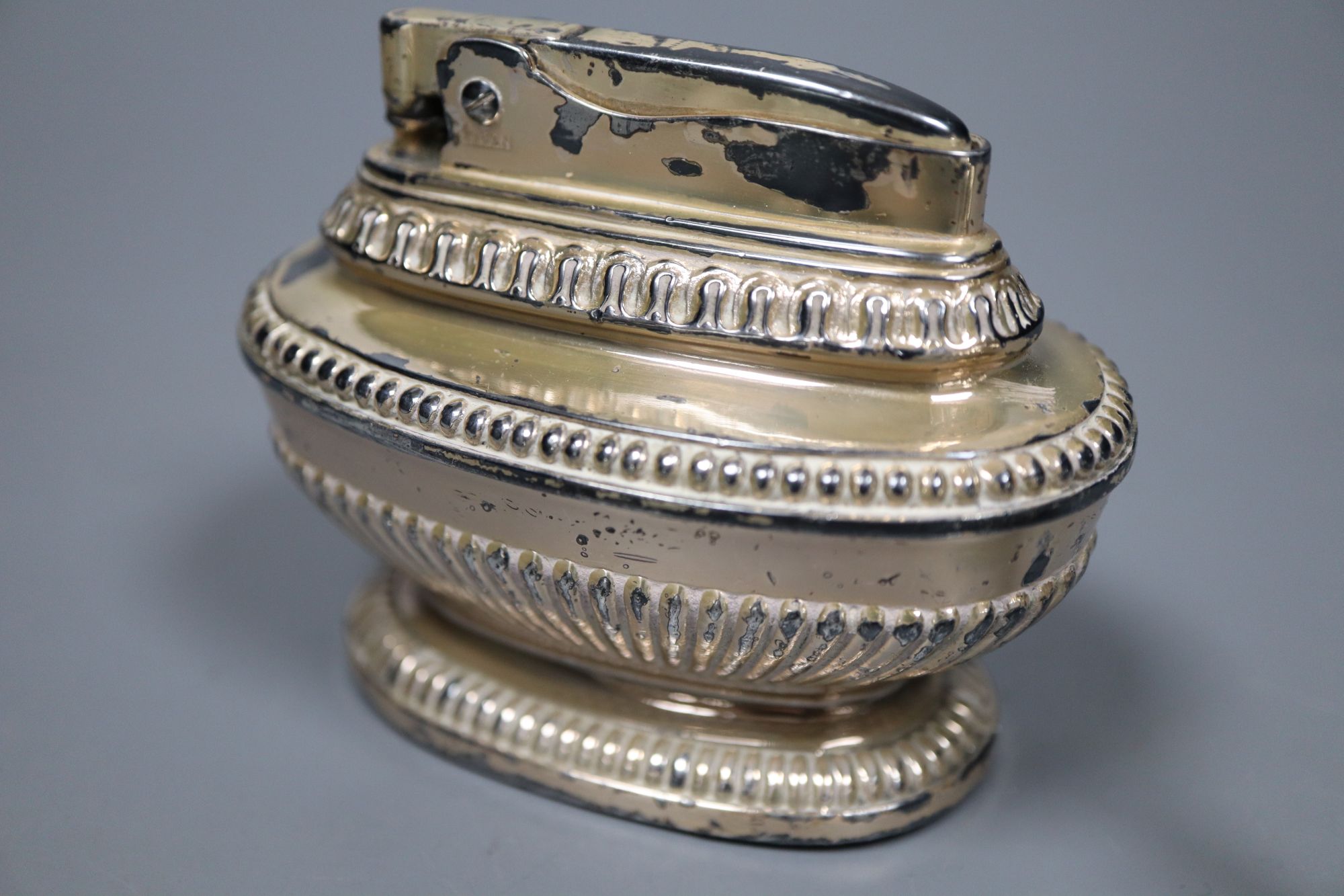A peppermill, a three piece condiment set, a Victorian christening spoon and a plated lighter